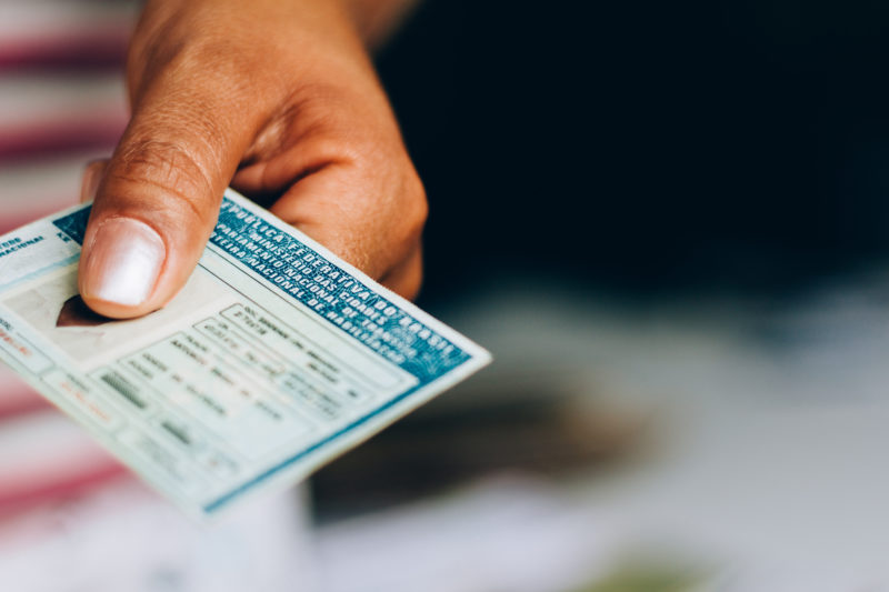 September 10, 2019, Brazil. Man holds National Driver's License (CNH). Official document of Brazil, which attests the ability of a citizen to drive land vehicles.